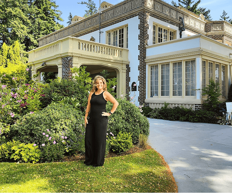 Denise in front of a fancy building