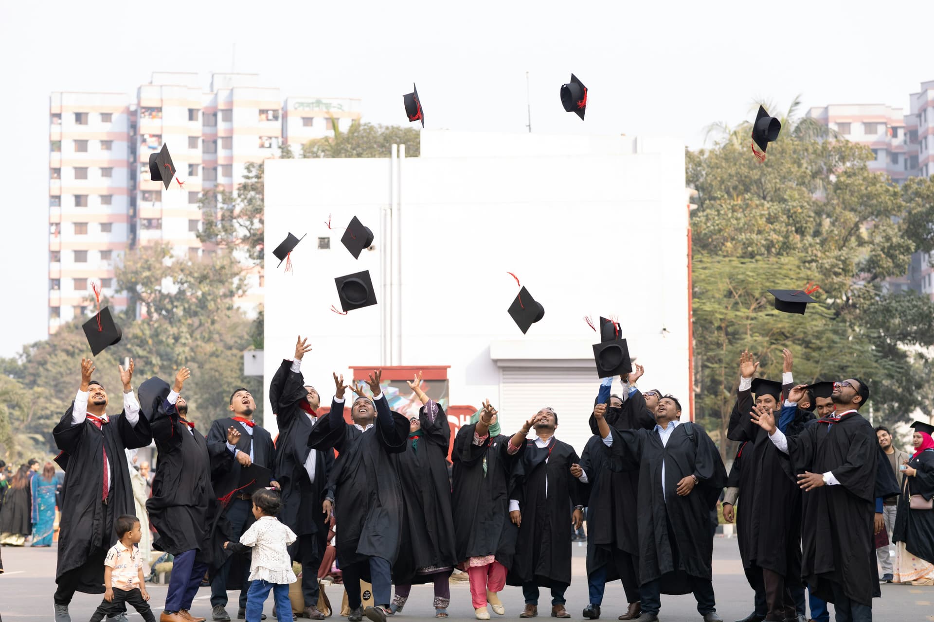 graduates throwing hats